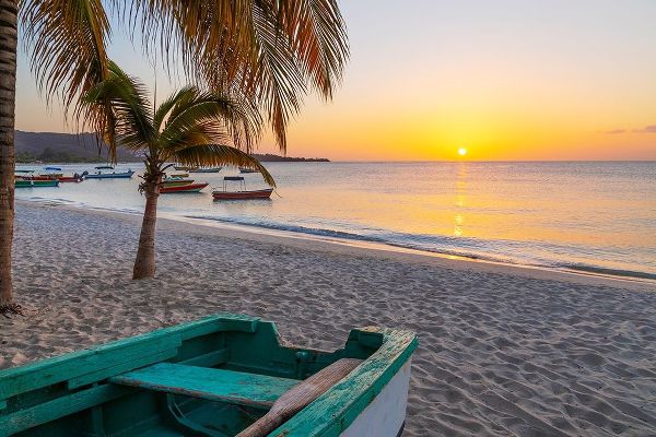 Caribbean-Grenada-Grenadines Sunset and wooden fishing boat on Grand Anse Beach